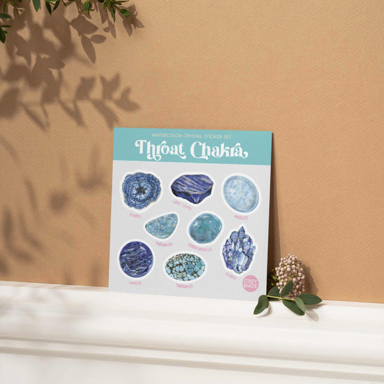 Throat Chakra Crystal Sticker Set against a brown wall