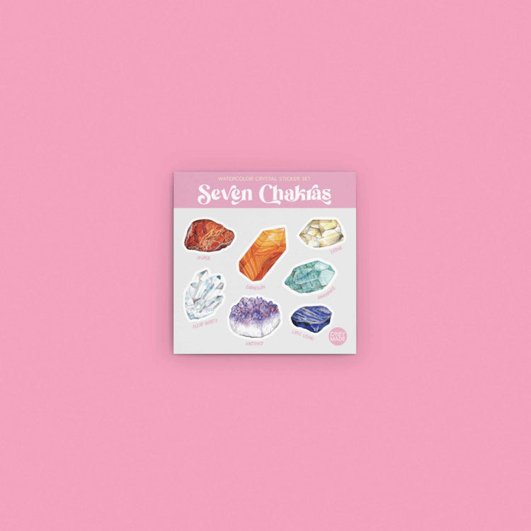 the watercolor crystal seven chakras sticker sheet on a pink background