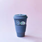 a blue to go coffee cup with an iolite and  fluorite sticker on it