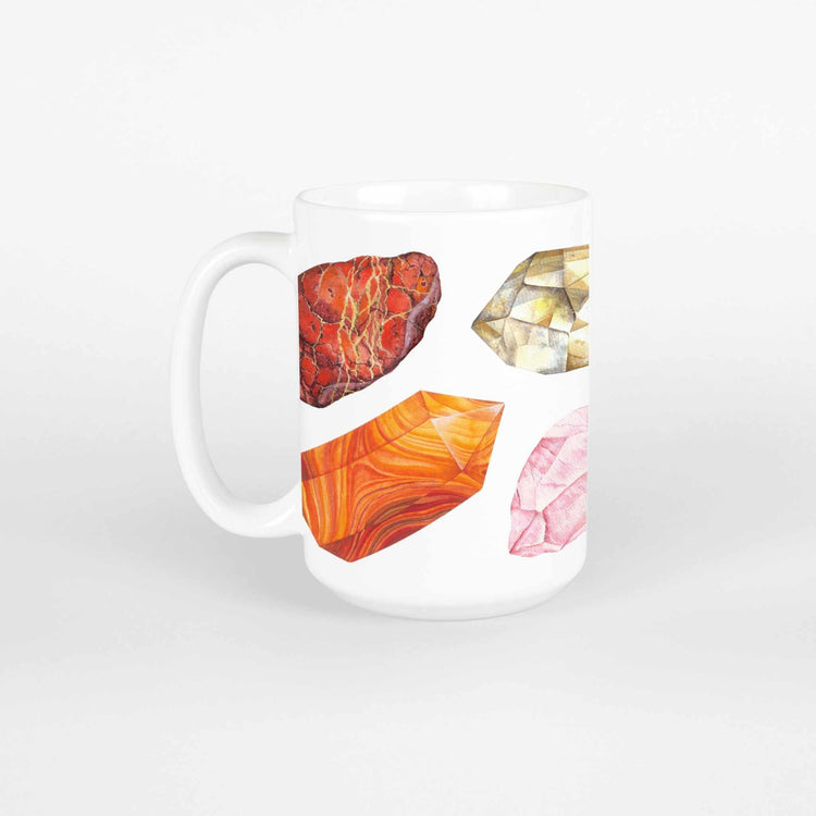 a white coffee mug with a picture watercolor crystals representing the 7 chakras