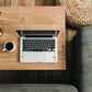 a laptop with Solar Plexus Chakra Crystal Stickers on it, sitting on top of a wooden table