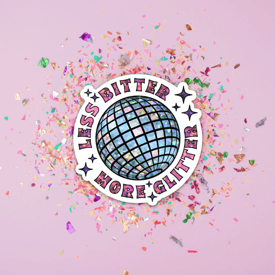 a disco ball surrounded by confetti and sprinkles