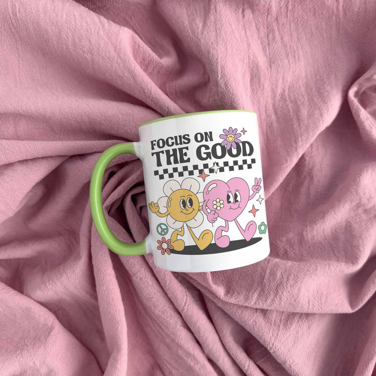 a pink blanket with a coffee mug on it