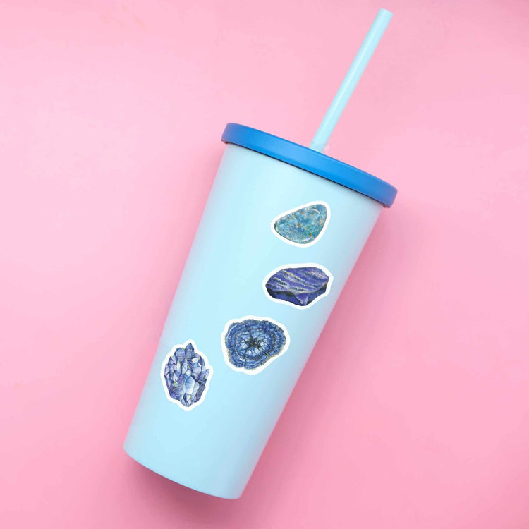 Throat Chakra Crystal Stickers on a blue to go cup on a pink background