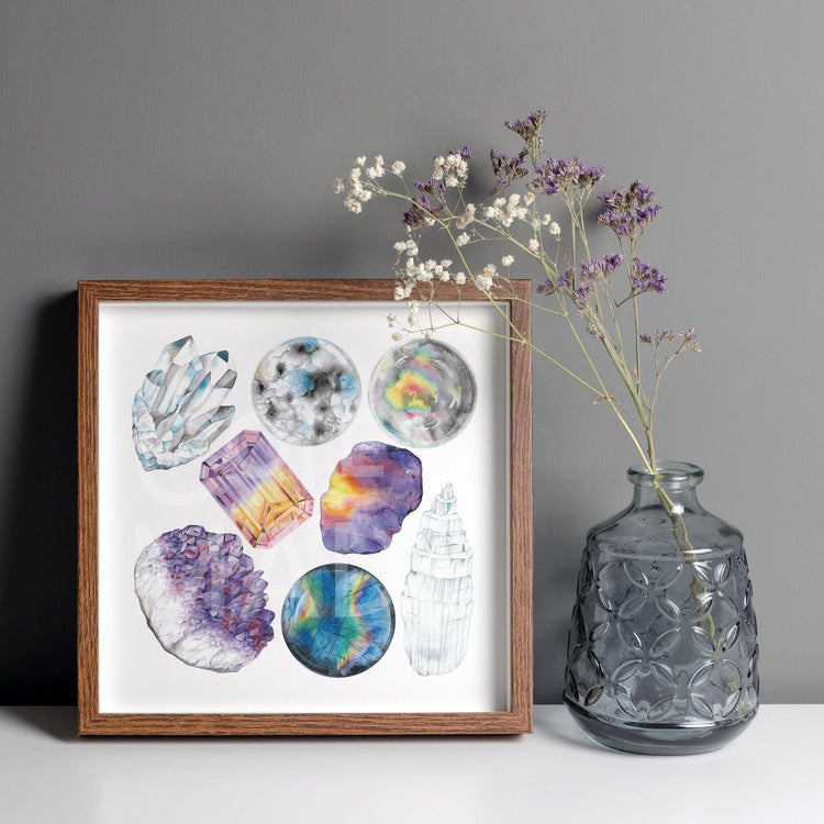 a picture of the Heart Chakra Watercolor Crystal Art Print leaning on a wall next to a plant