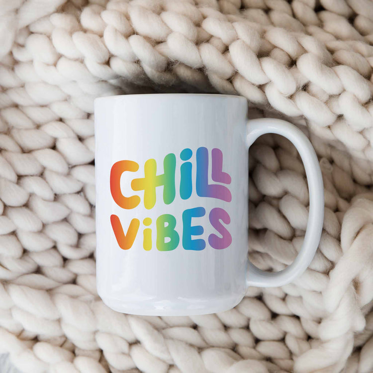 a white coffee mug with the words chill vibes on it