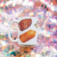 a white coffee mug with a picture watercolor crystals representing the 7 chakras