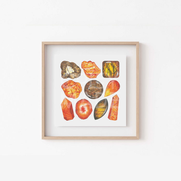 a white wall with a wooden frame holding a picture of the sacral Chakra Watercolor Crystal Art Print