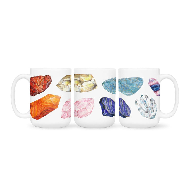 a white coffee mug with a picture watercolor crystals representing the 7 chakras